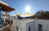 16037, Two level house in the center of Lefkes village.  Parking nearby